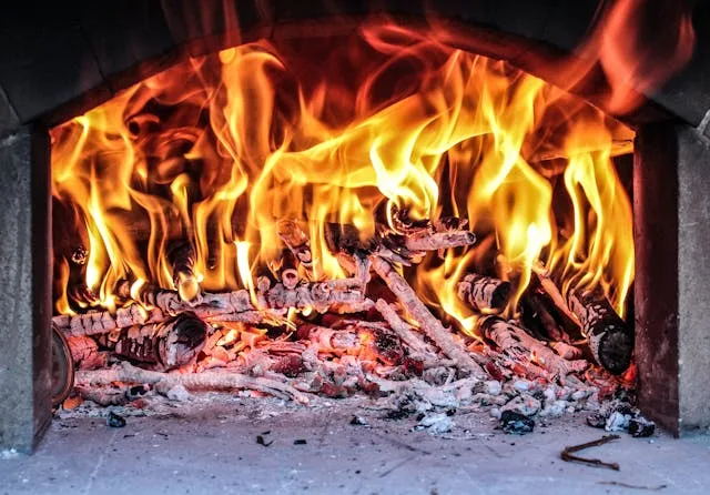 Active grease fire flames on outdoor gas grill Grease Fire Safety: How to Extinguish & Prevent Grill Flames